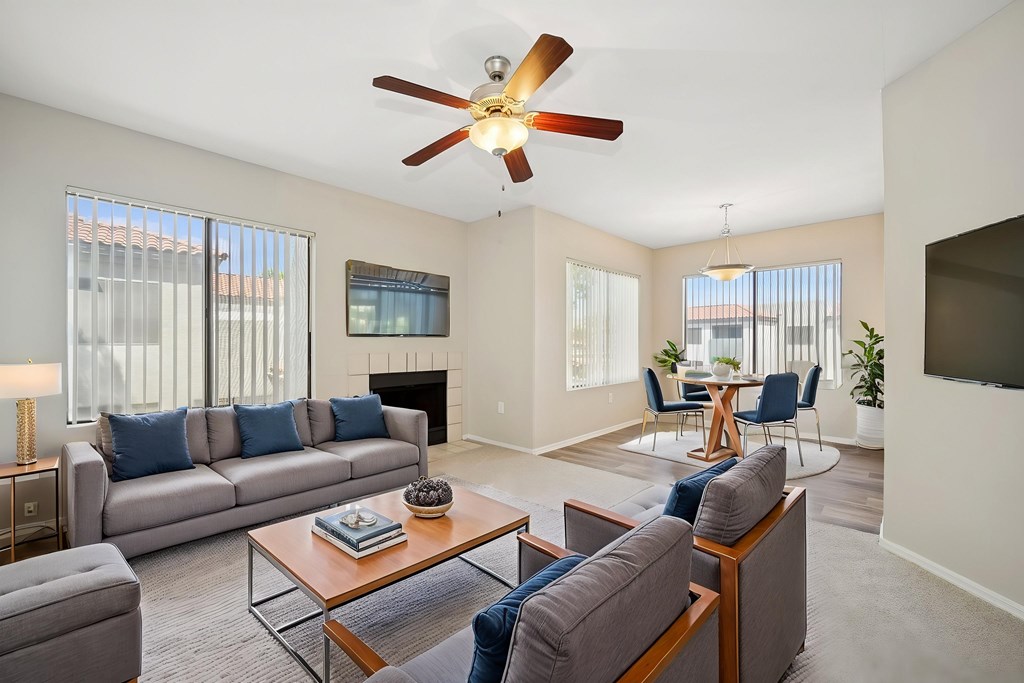 A living room with a grey couch and a coffee table.
