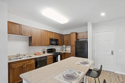 a kitchen with a granite counter top and a table