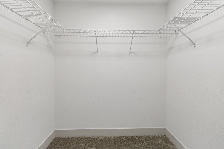 closeted and spacious closet with metal racks