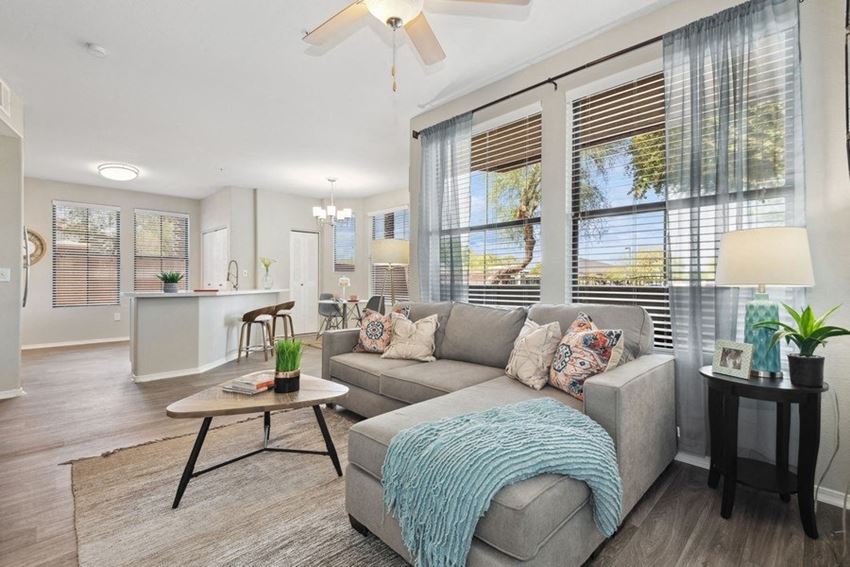 a living room with a couch and coffee table - Photo Gallery