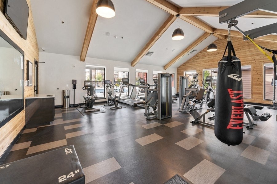 the gym with weights and cardio equipment at the oxford condos tx
