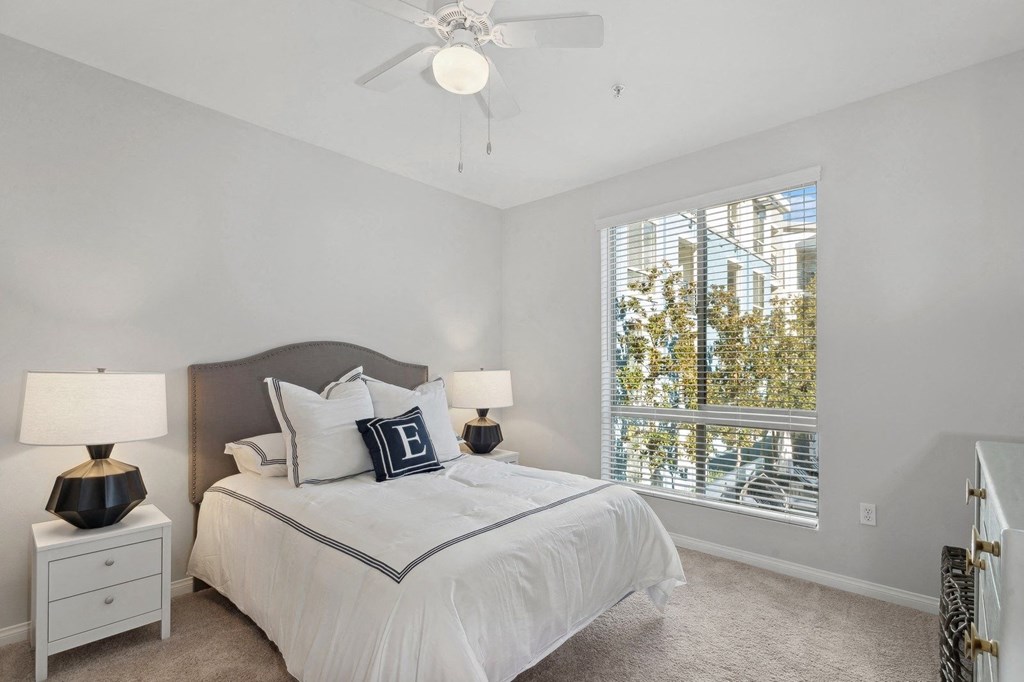 Spacious bedroom with a large window