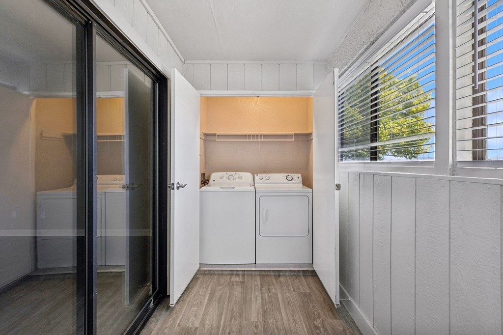 a laundry room with a washer and dryer in it