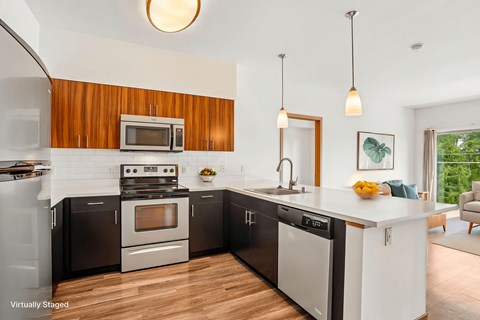 A modern kitchen with a wooden backsplash and stainless steel appliances.