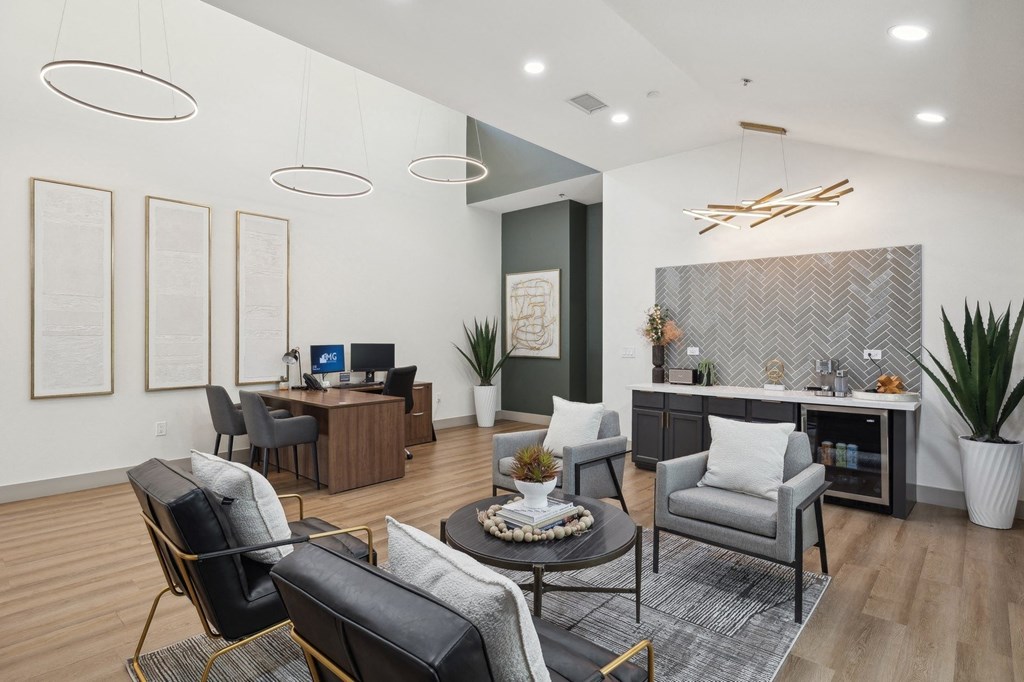 a living room with couches and chairs and a table