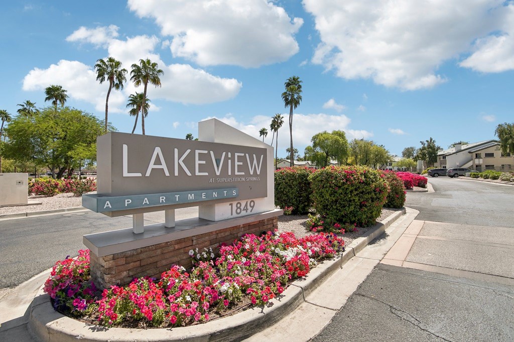 A sign for Lakeview Apartments with a phone number on it.