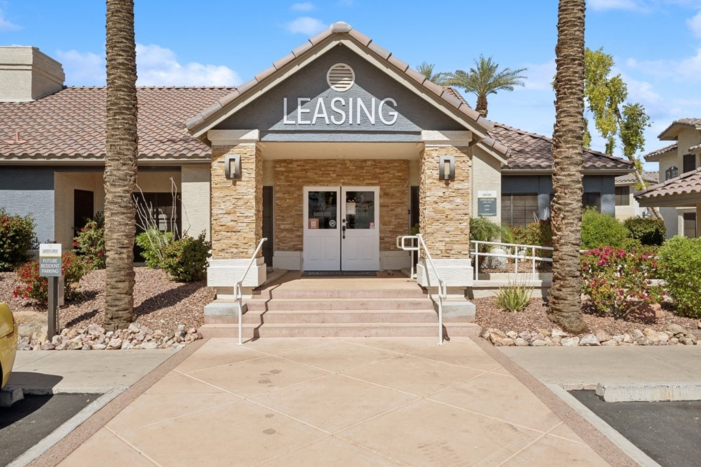 A leasing office surrounded by palm trees