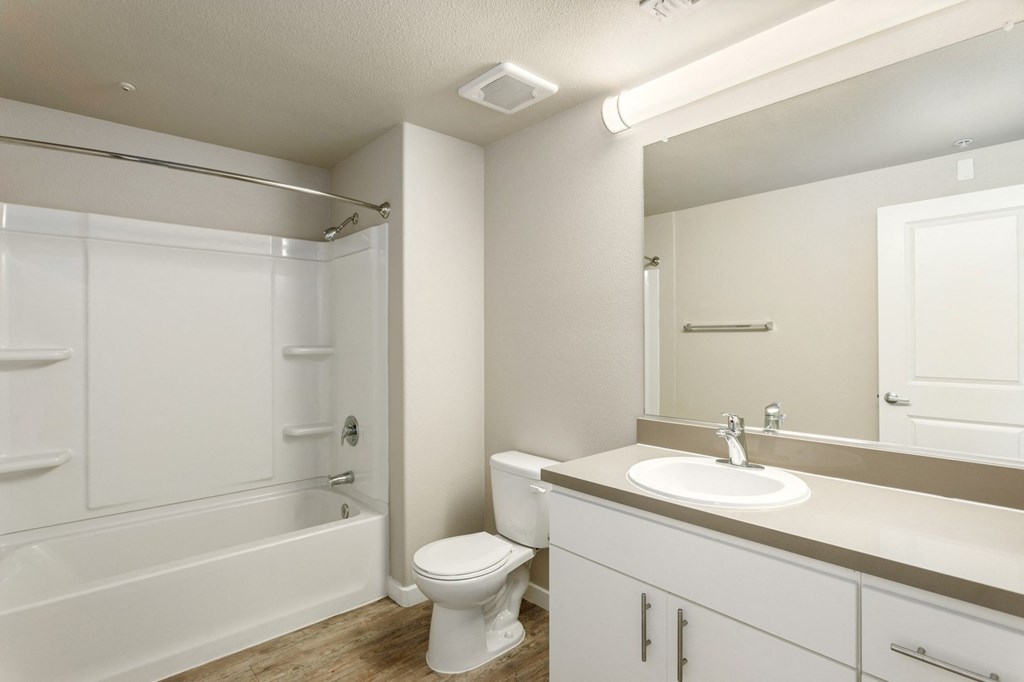 a bathroom with a sink toilet and a shower