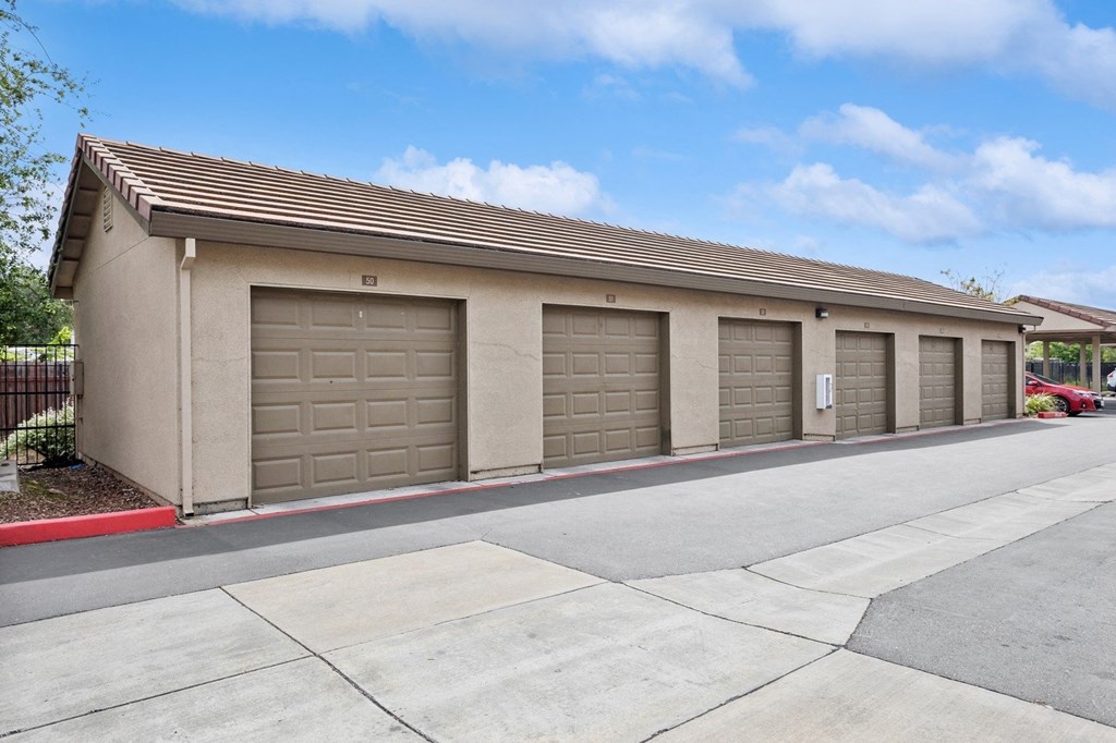 a row of garage doors on the side of a building