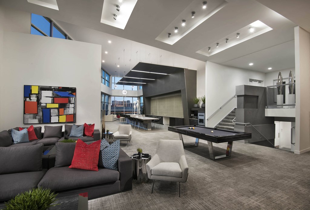 community lounge with couches and a pool table