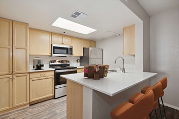 Kitchen island seating at Garden Grove Apartments - Photo Gallery 4
