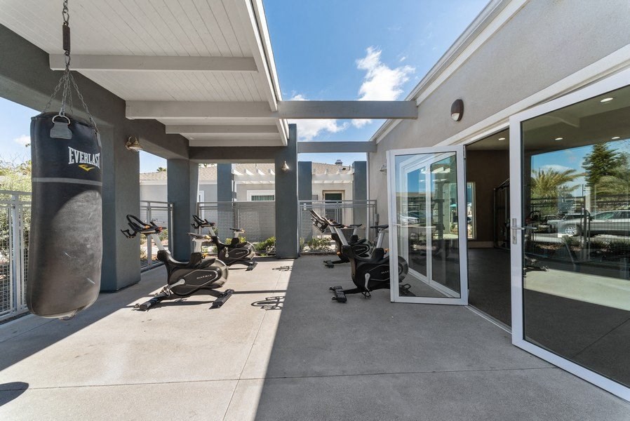 gym with outdoor workout area at Pointe Luxe Apartment Homes, San Diego, CA