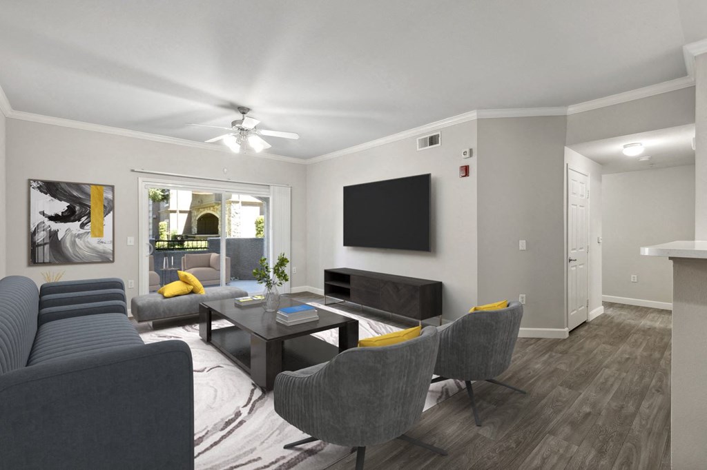 a living room with couches and a table and a television