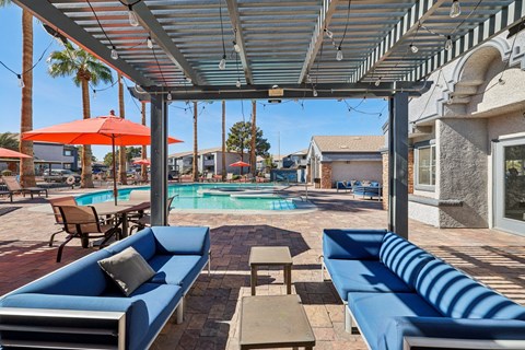 Poolside cabana with blue furniture