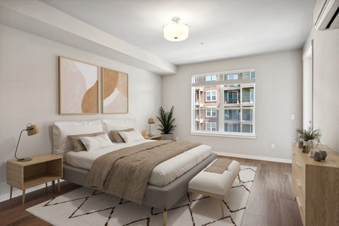 a bedroom with a large bed and a window