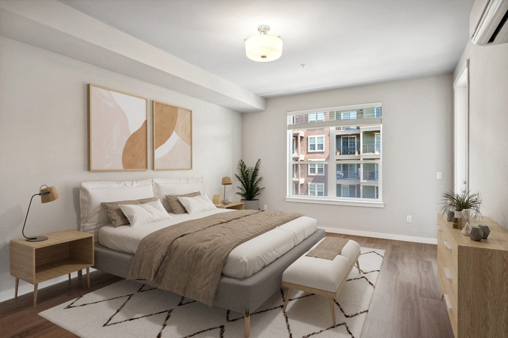a bedroom with a large bed and a window