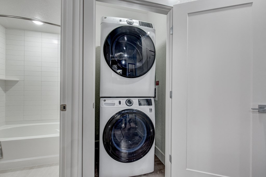 a small laundry room with a washer and dryer