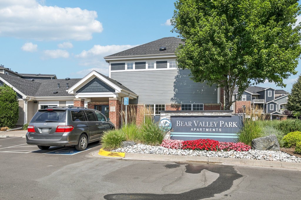 A Bear Valley Park sign is in front of a building.