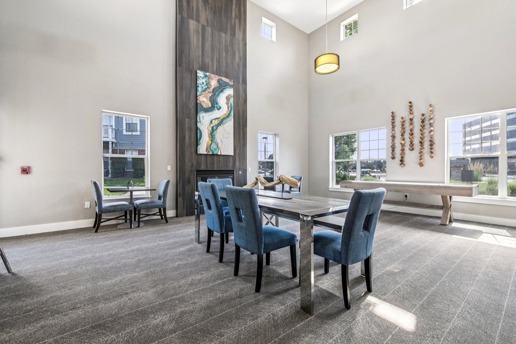 A conference room with a long table and chairs.