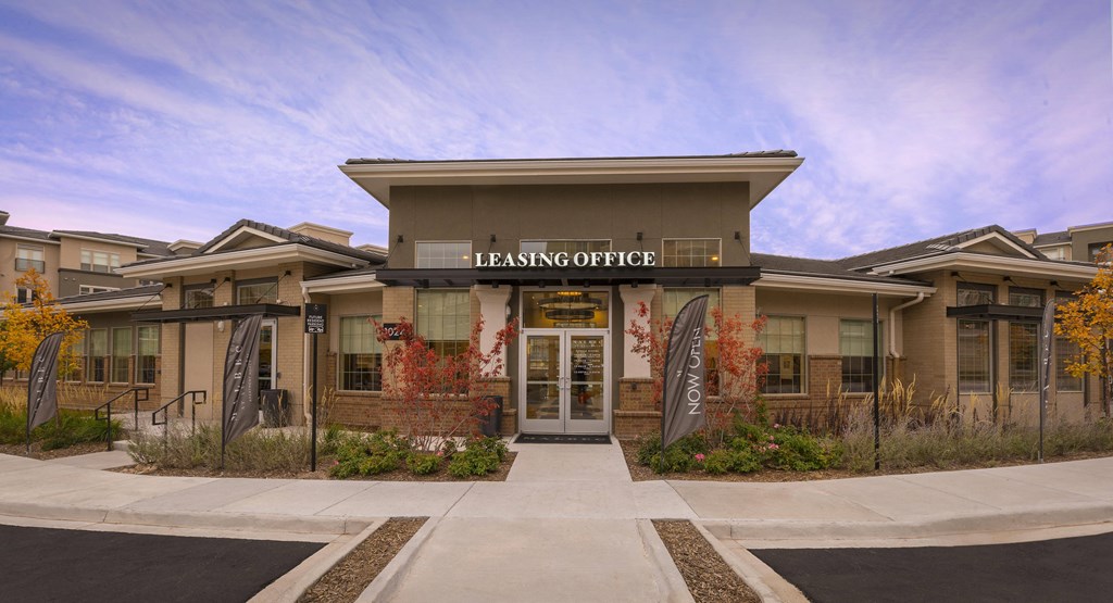 a building with the leasing office on the front of it