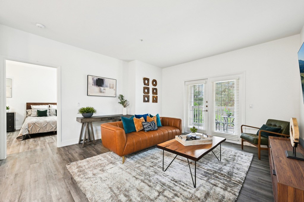Living room with brown leather couch and coffee table