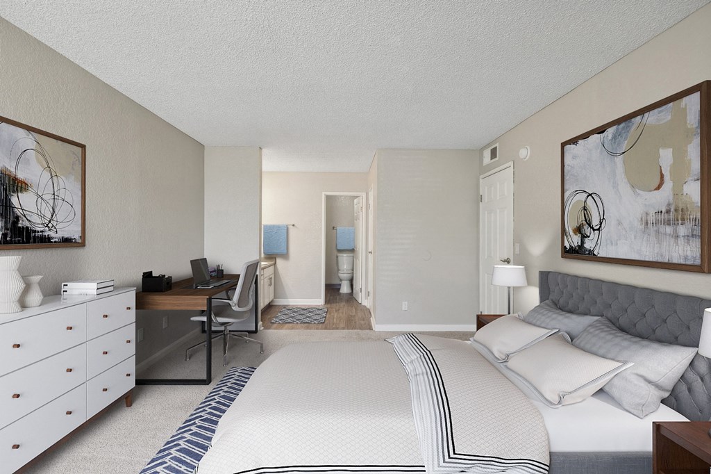 a bedroom with a bed and a desk with a chair