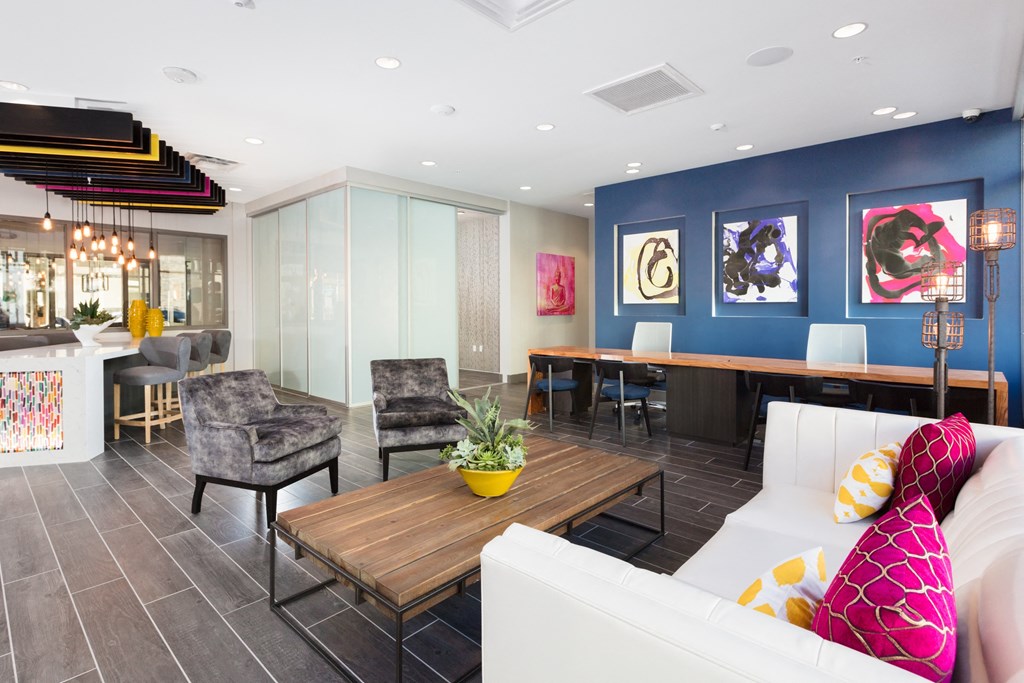 a living room filled with furniture and a large window