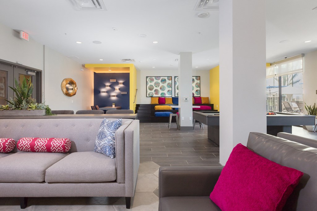 a living room with couches and chairs