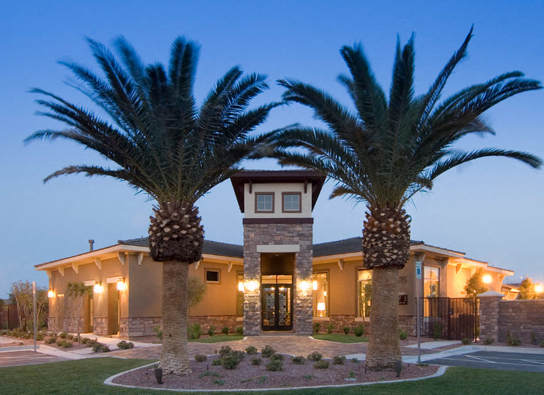 a building with palm trees in front of it