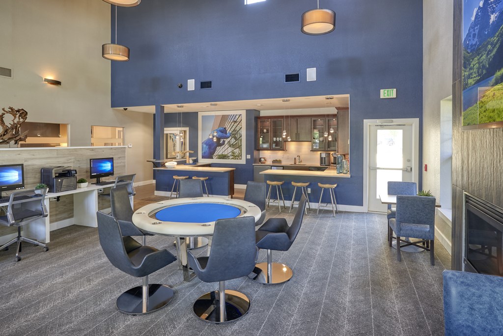 a conference room with a table and chairs and a fireplace