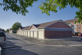 a row of garages on the side of a street