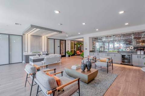 A modern living room with a grey sofa and a wooden coffee table.