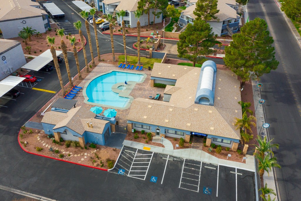an overhead view of a swimming pool in a parking lot