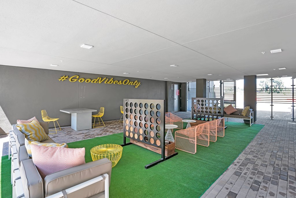outdoor game and lounge area at Aya Apartments
