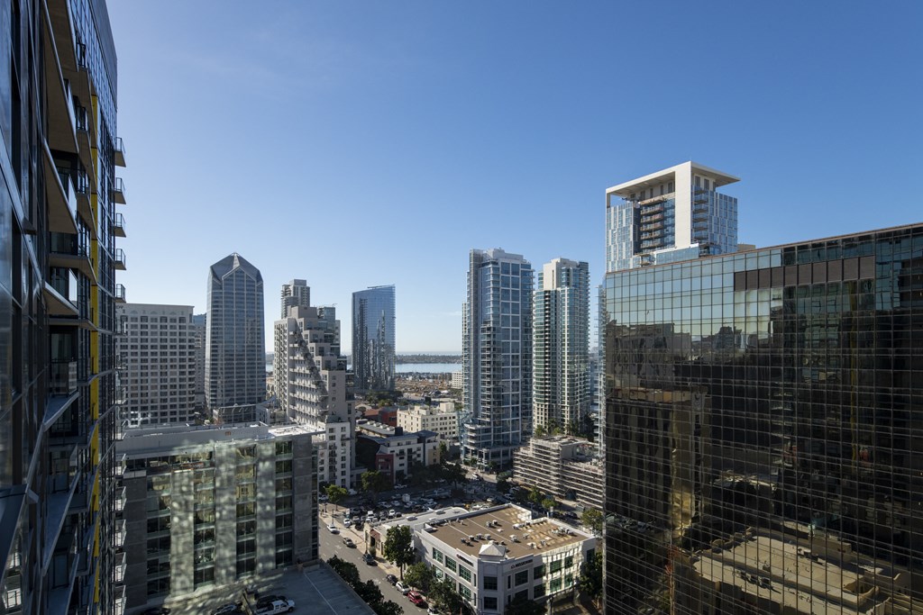 a view of the city from a skyscraper with tall buildings
