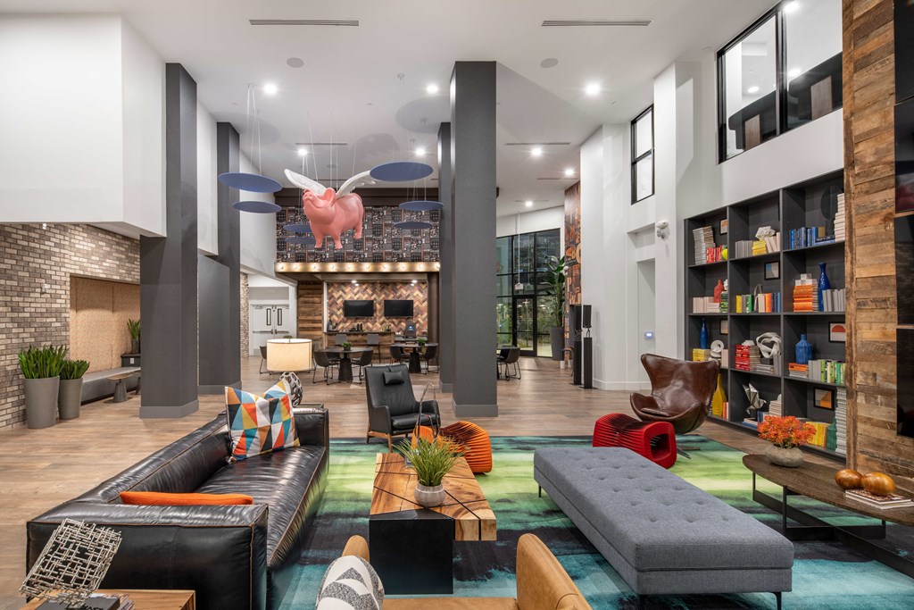 a living room with couches and chairs and a fireplace