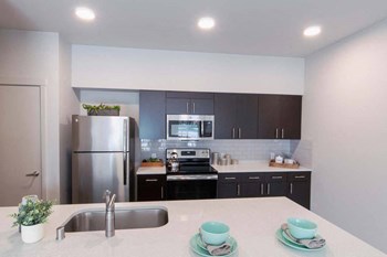 Polished quartz kitchen countertops Polished quartz kitchen countertops at Hearth Apartment Homes, Washington, 98684 - Photo Gallery 2