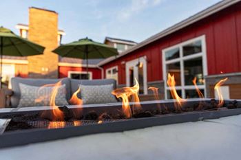 Terrace with outdoor fireplace at Hearth Apartment Homes, Washington