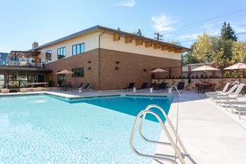Pool Side Relaxing Area With Sundeck at Tivalli Apartments, Lynnwood, WA - Photo Gallery 11