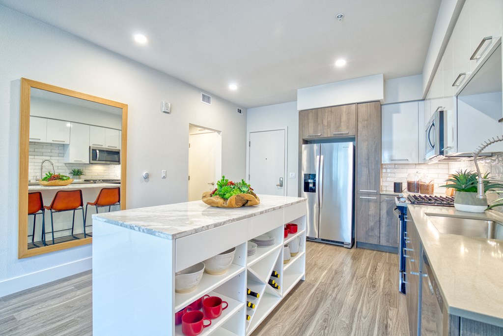 spacious kitchen with an island at Aya Apartments
