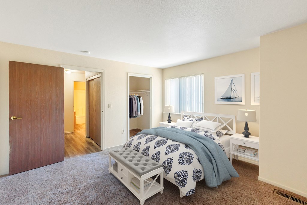 a bedroom with a bed and a closet
