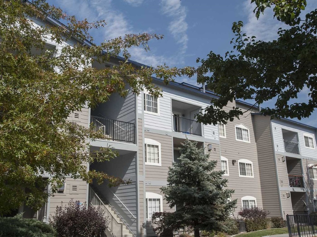 Building exterior with foliage at Marina Village Apartments, Sparks 89434