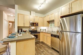 Refrigerator with Ice Maker, at Newberry Square Apartments, Lynnwood, Washington - Photo Gallery 1