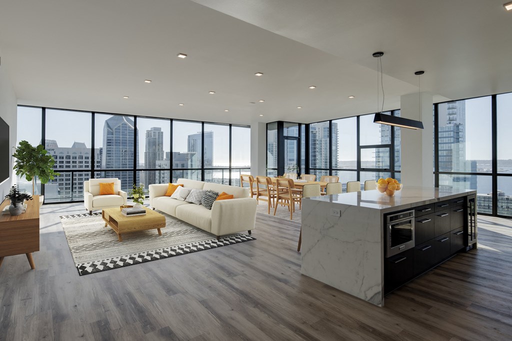a living room with a kitchen and a city view