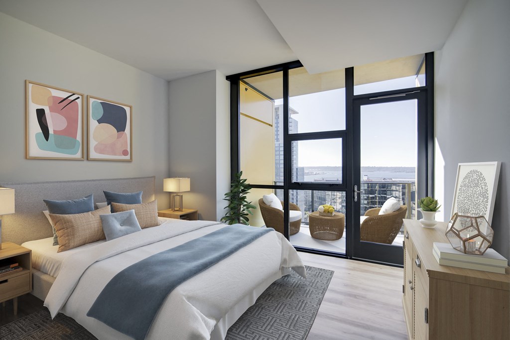 a bedroom with a large bed and a balcony