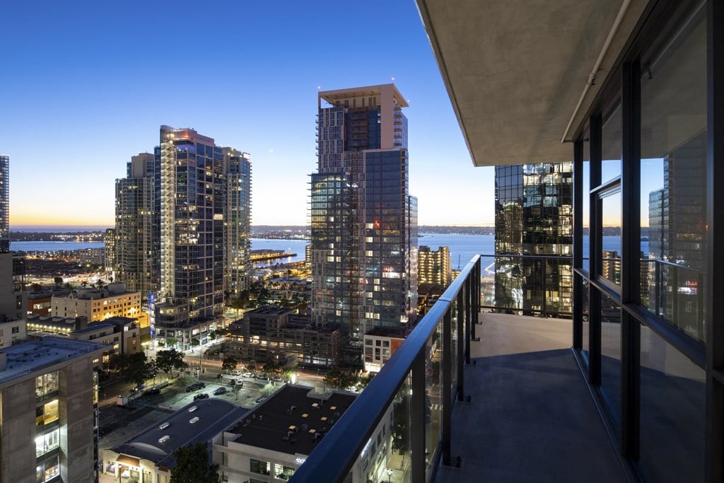 a balcony with a view of San Diego at night