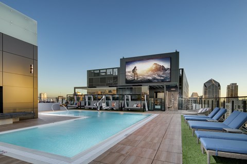 rooftop resort style pool with TV at Luma