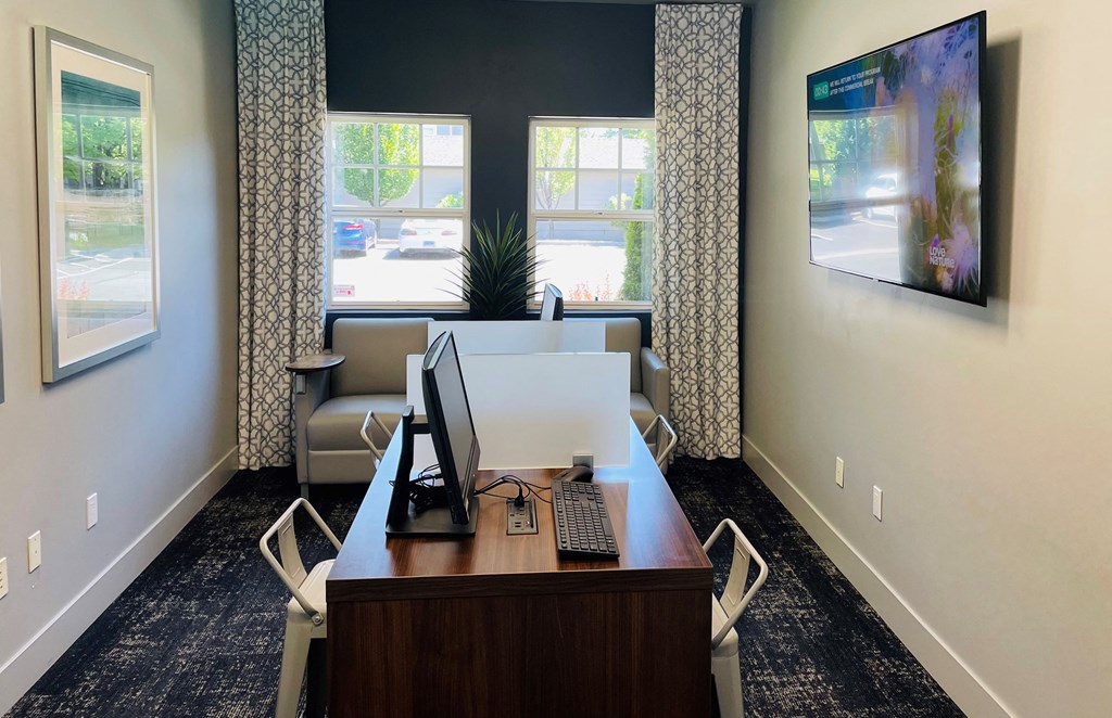 an office with a desk and two chairs