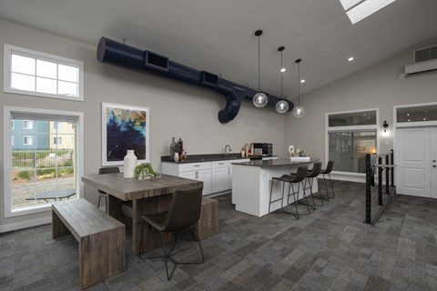 a large kitchen and dining room with a table and chairs