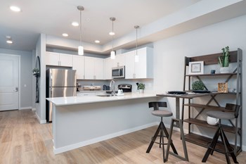 Kitchen seating at Village on Main Apartments - Photo Gallery 2